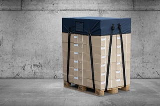Top and strap pallet cover on concrete
